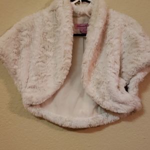 Off white faux fur jacket or throw.